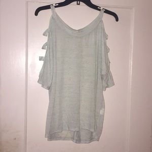 Light green t-shirt with sleeve cutouts